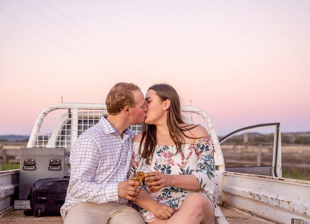 Engagement Photography - couple kissing on back of ute