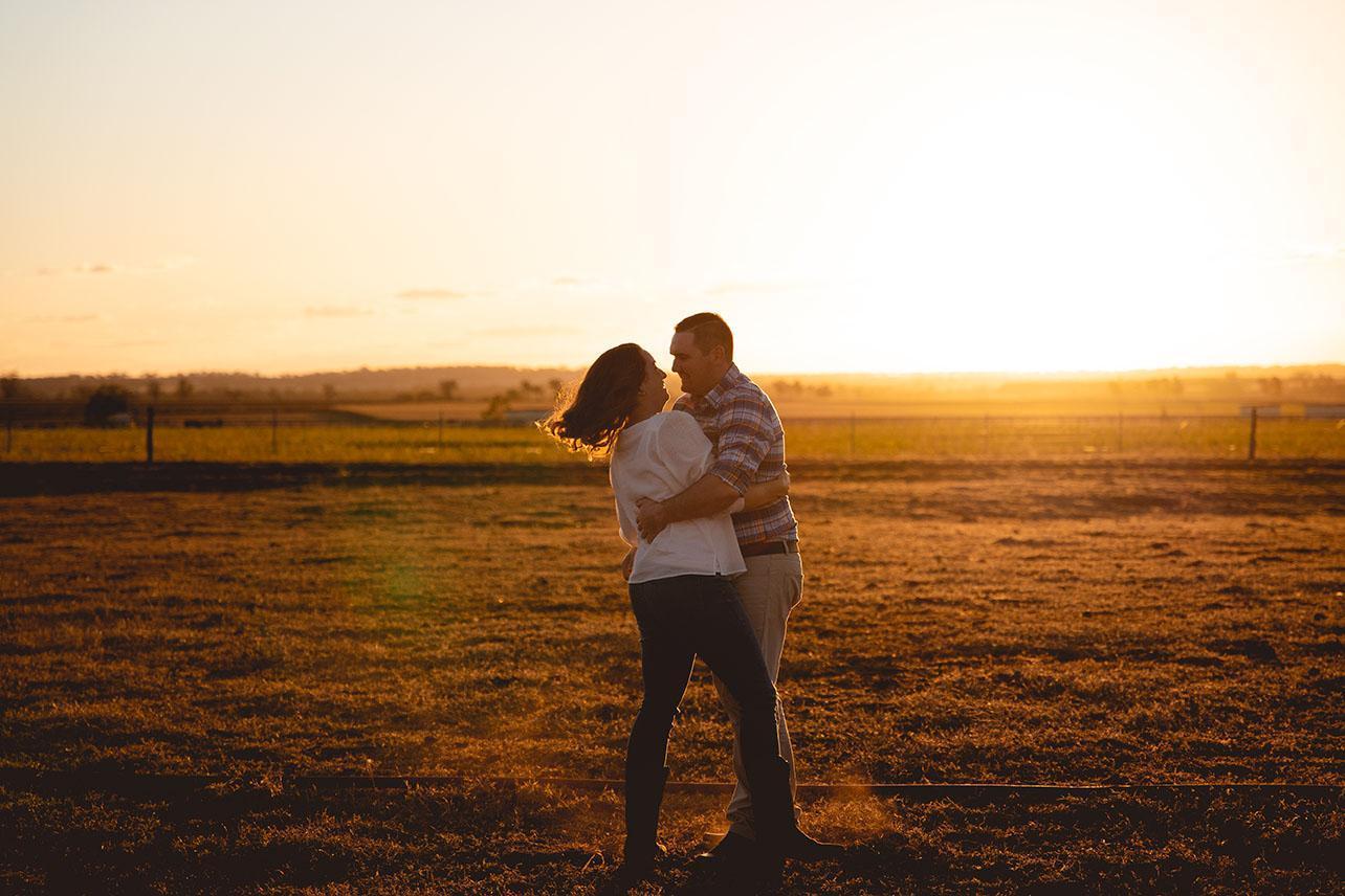 Engagement Photography - couple in field dancing