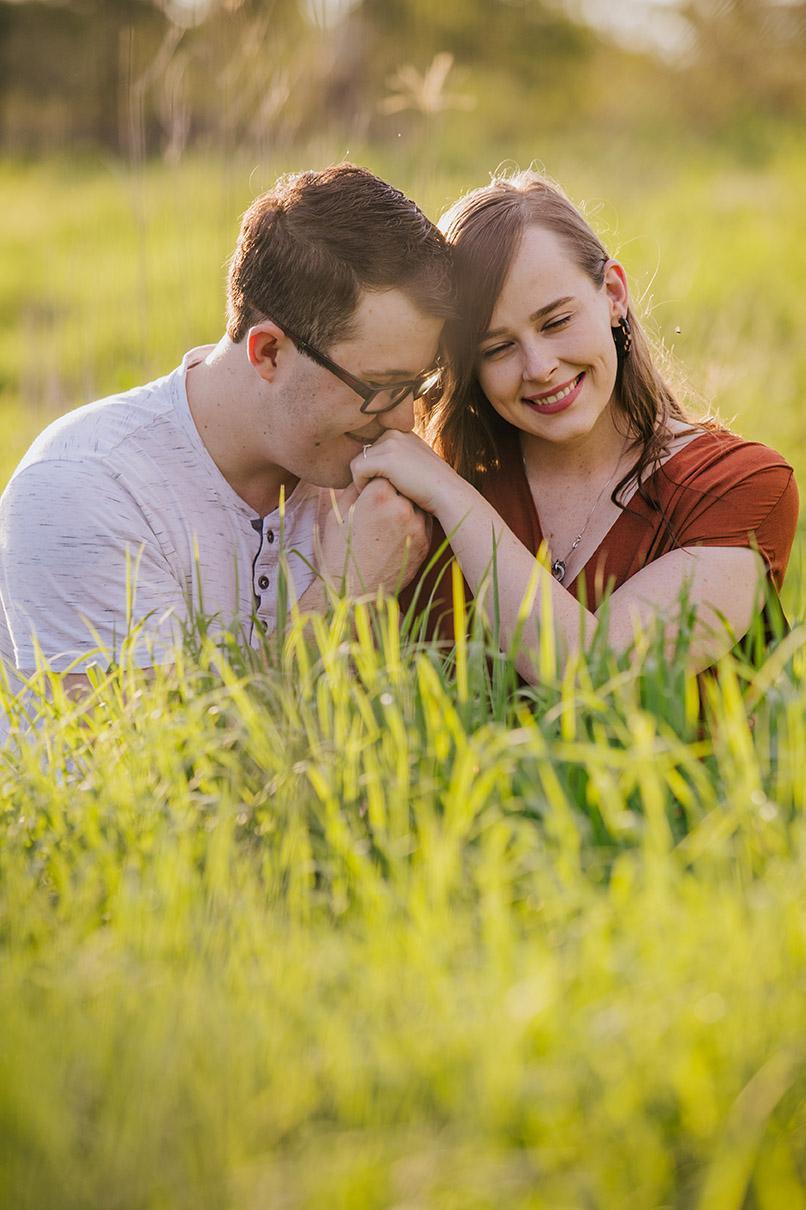 Engagement Shoot - couple laughing in field