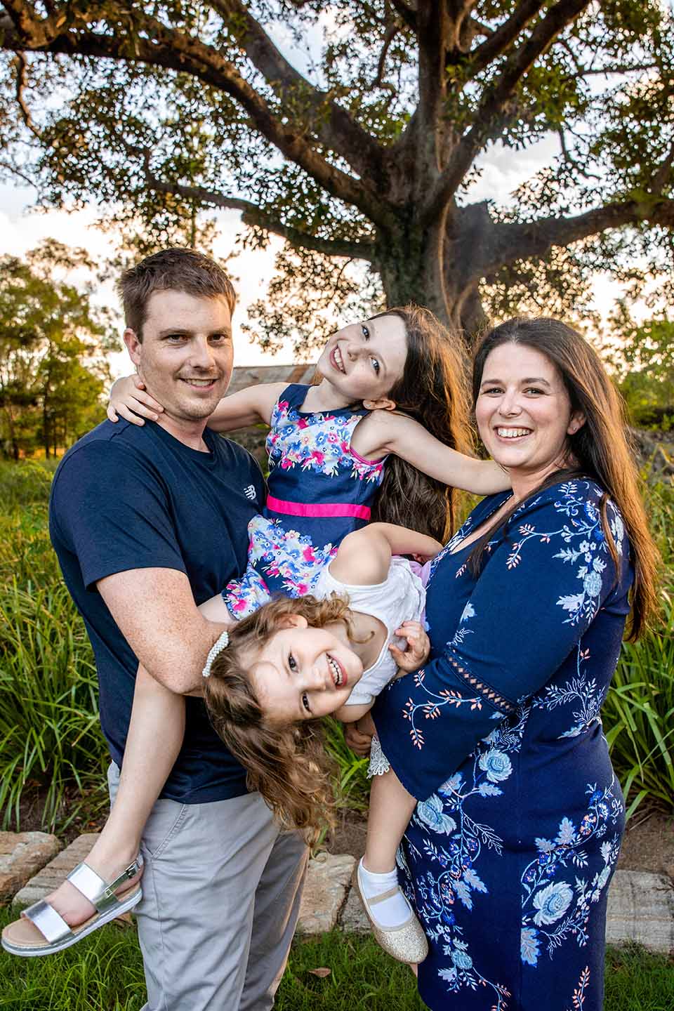 Family Photo - Husband, wife and young daughters