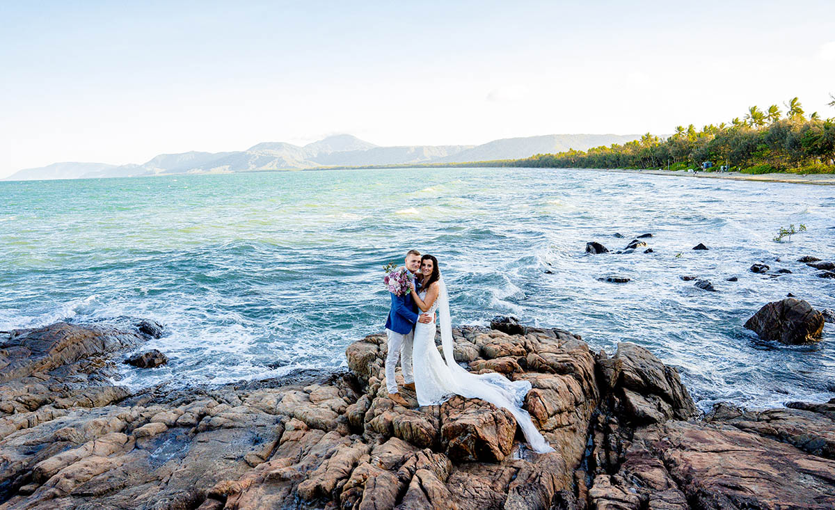 Destination Wedding Photography - couple on rocks in front of ocean
