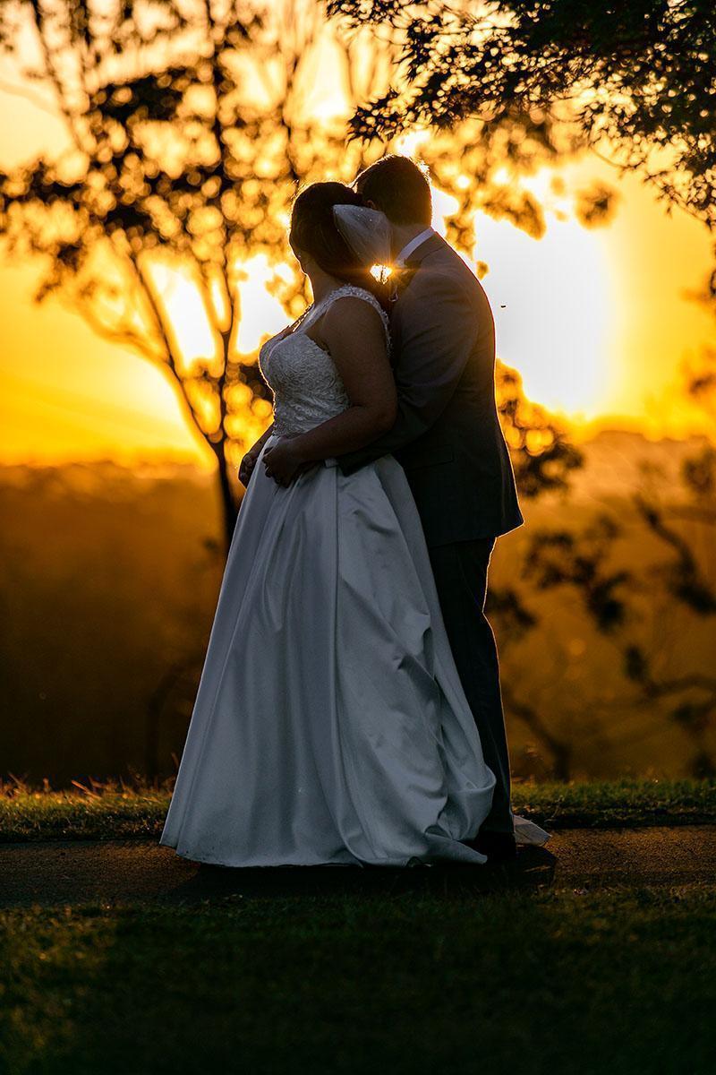 Wedding Photography - couple embracing at sunset