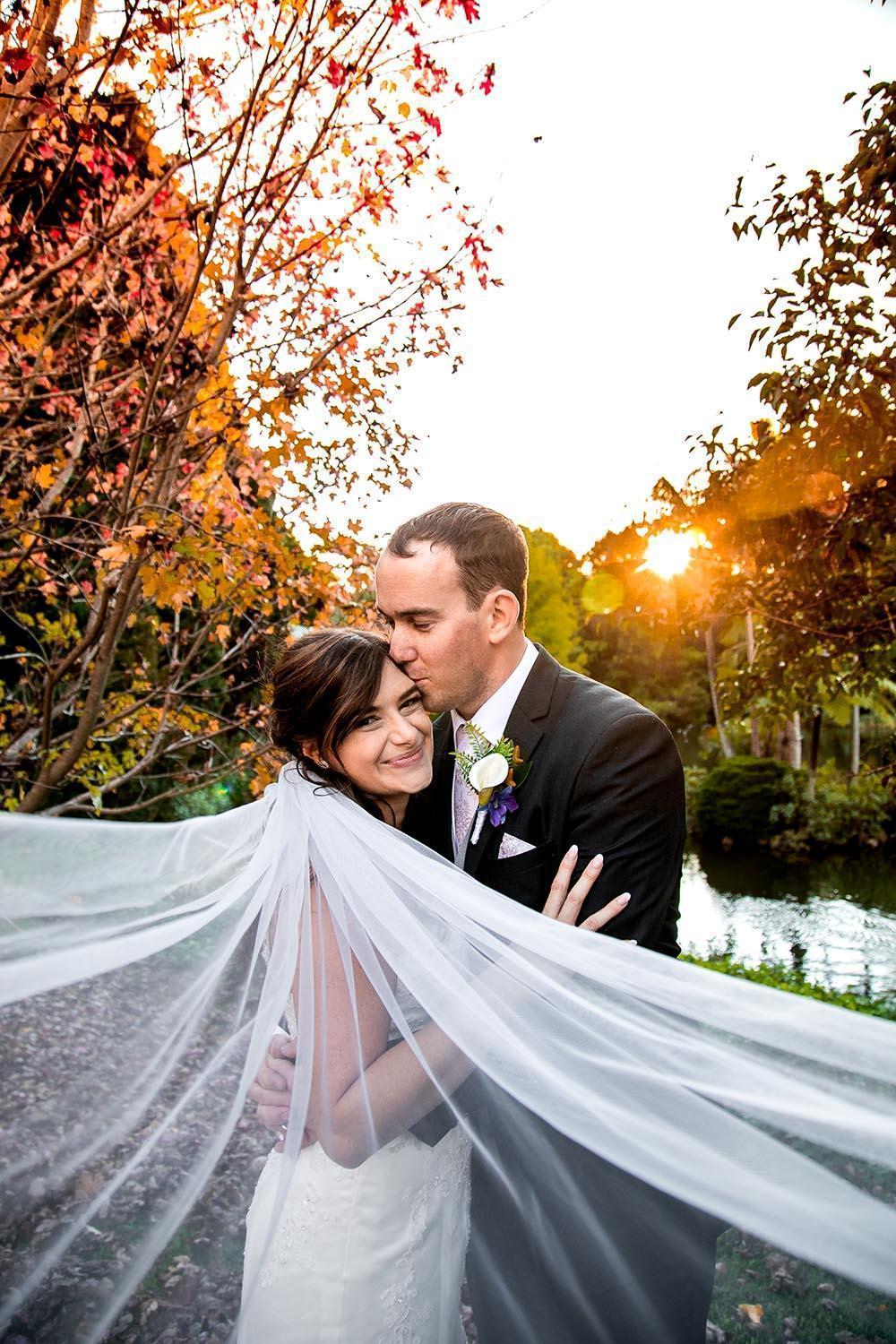 James& Megan Wedding Photography Couple Embracing with flowing veil