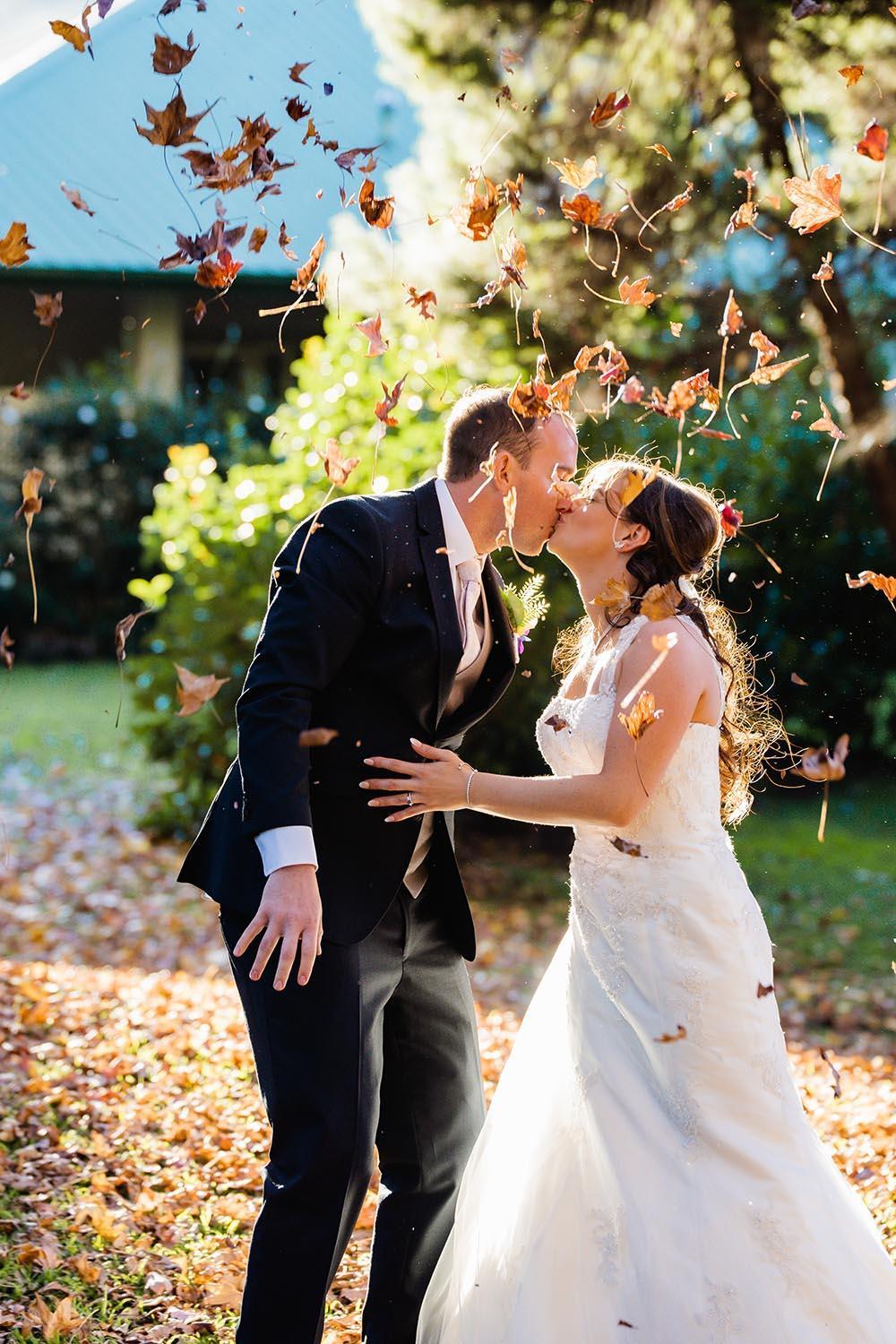 Wedding Photography Couple Throwing Leaves