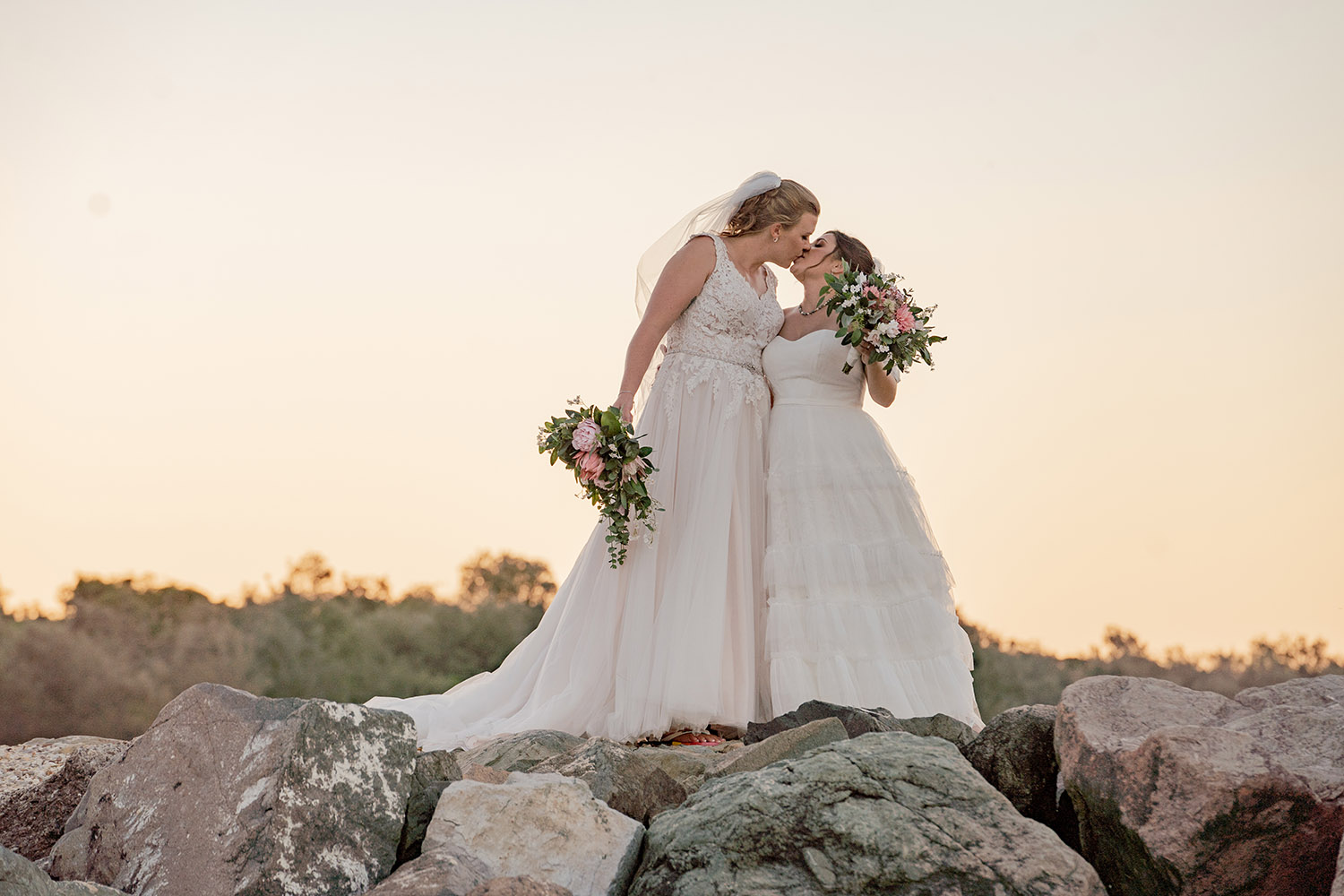 Wedding Photography - Brides kissing on beach