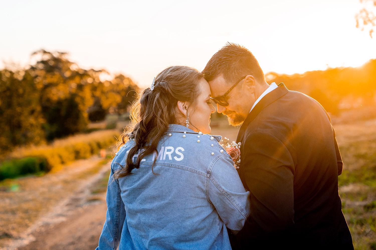 Wedding Photography - Couple embracing at sunset