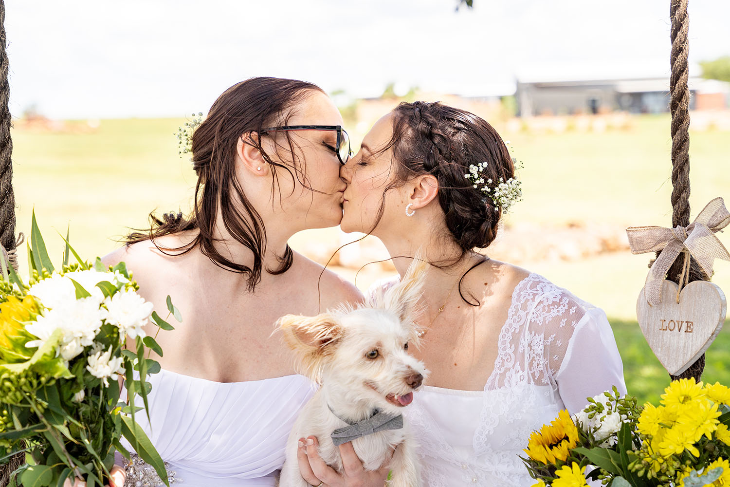 Wedding Photography - Kissing Brides with dog