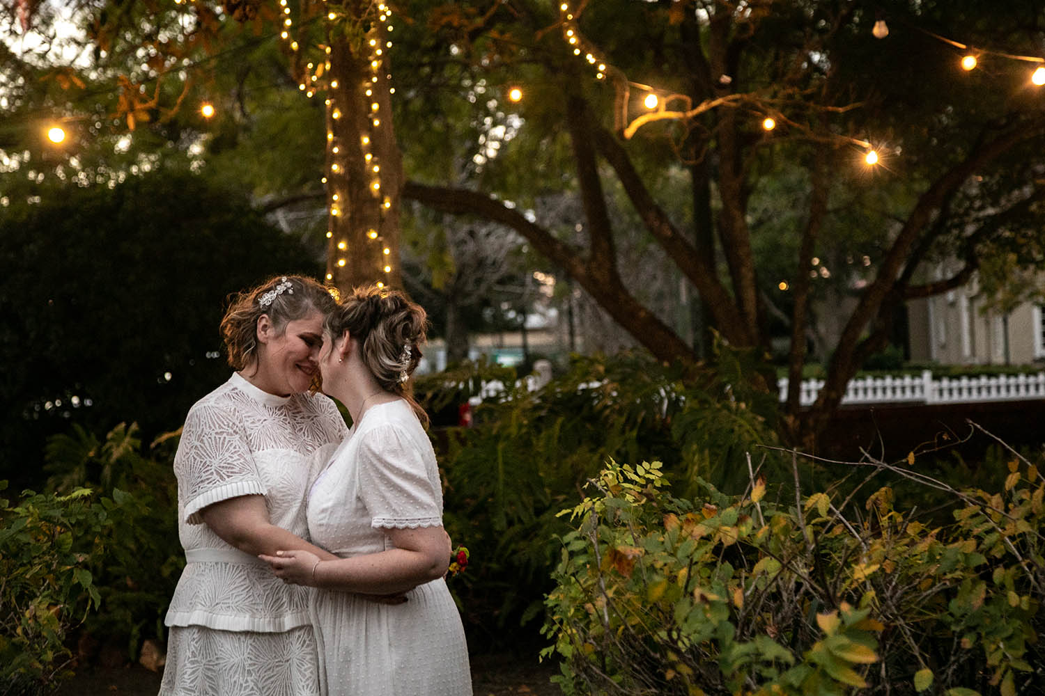 Wedding Photography - brides under twinkle light