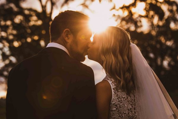 Wedding Photography kissing at sunset
