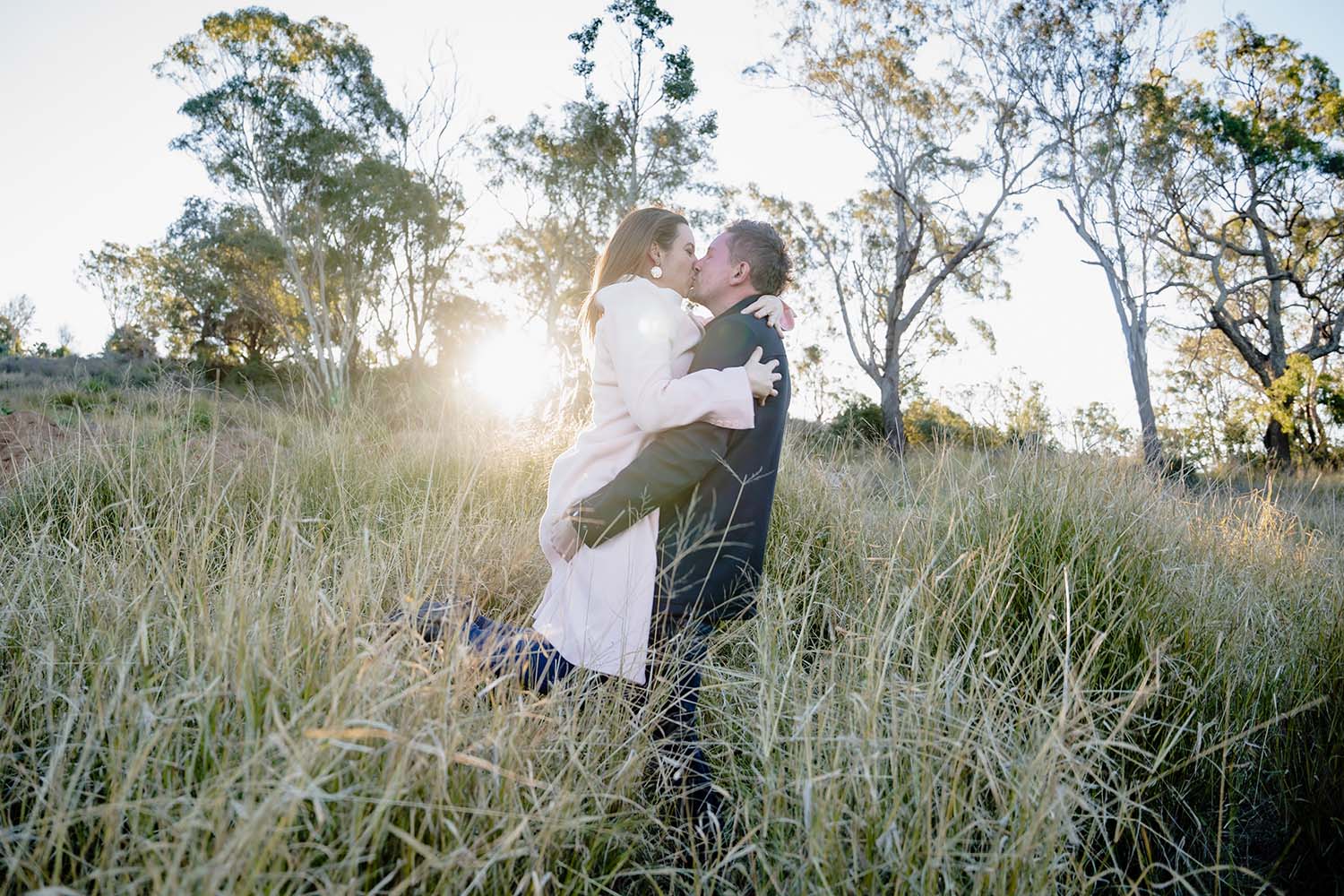 Engagement Photography - couple embracing in field