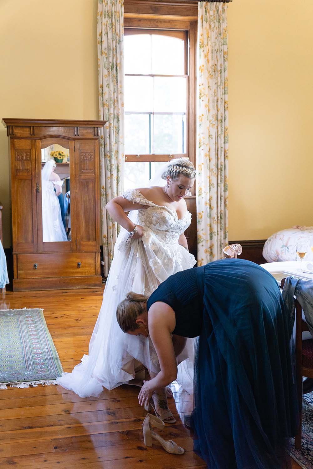 Wedding Photography - bride putting on shoes