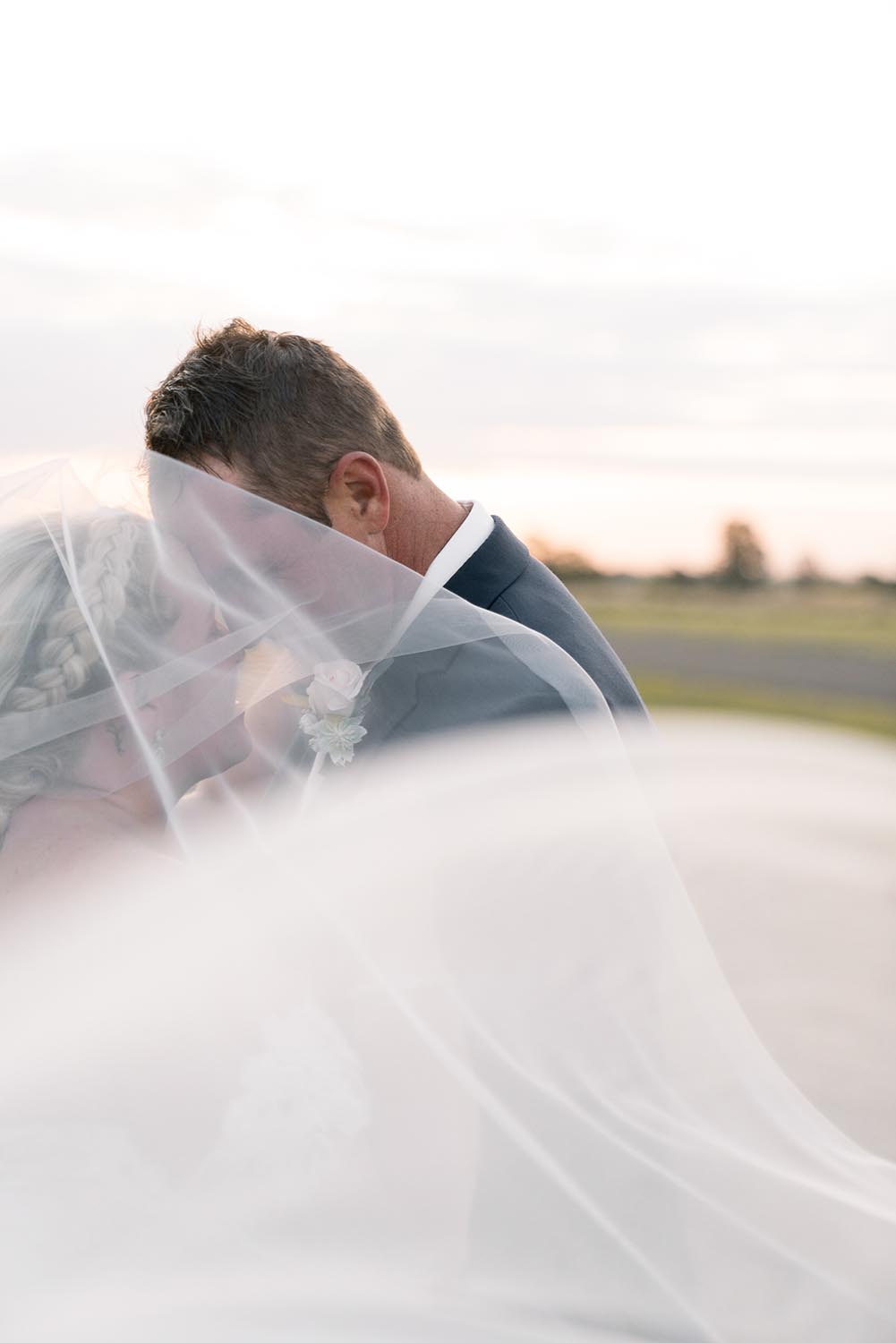 Wedding Photography - kiss behind veil