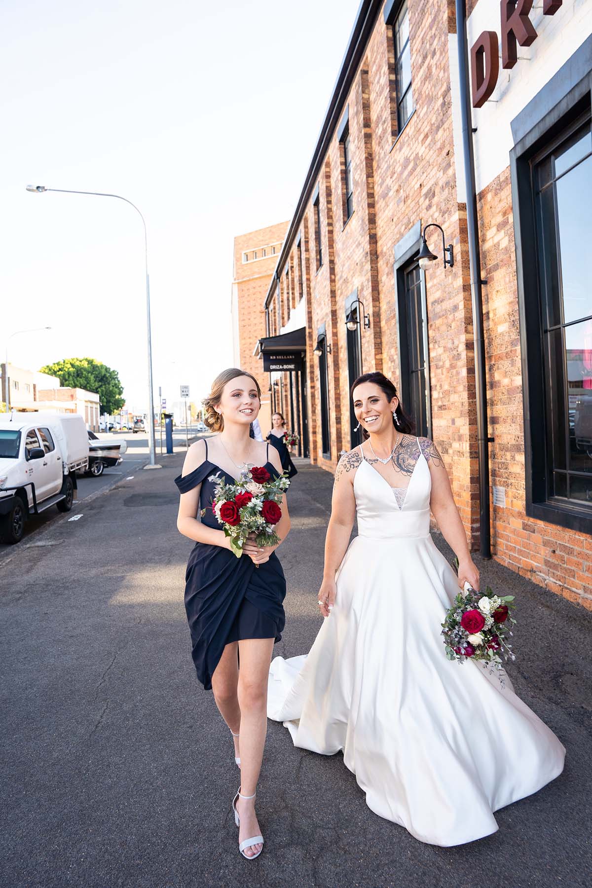 Wedding Photography - Bride and Bridesmaid walking