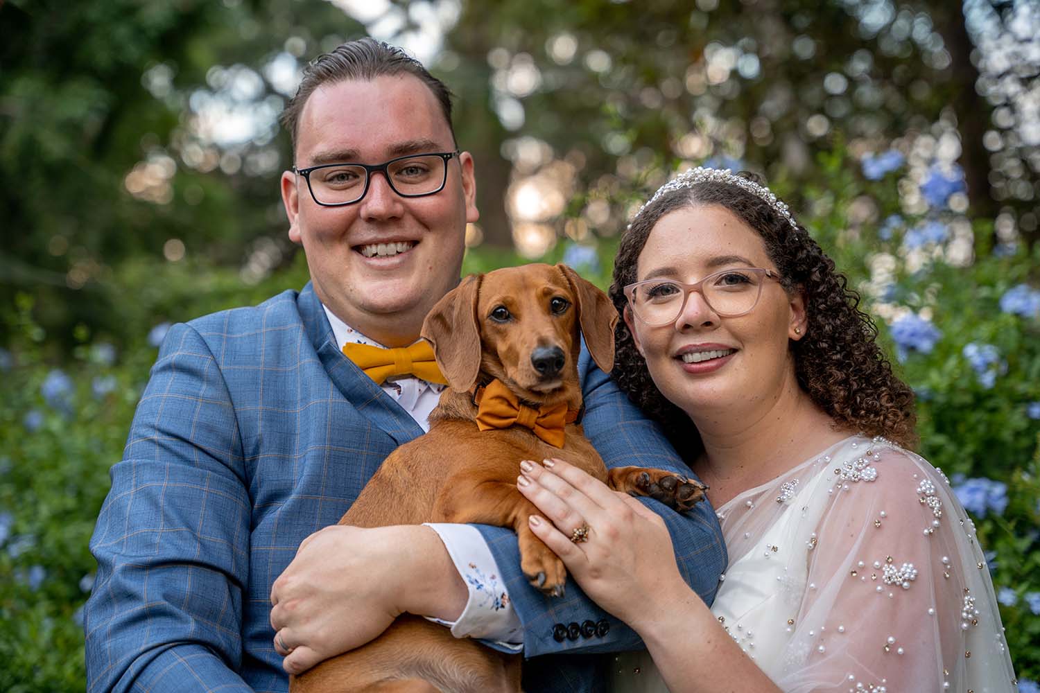 Wedding Photography - Bride and Groom holding dog