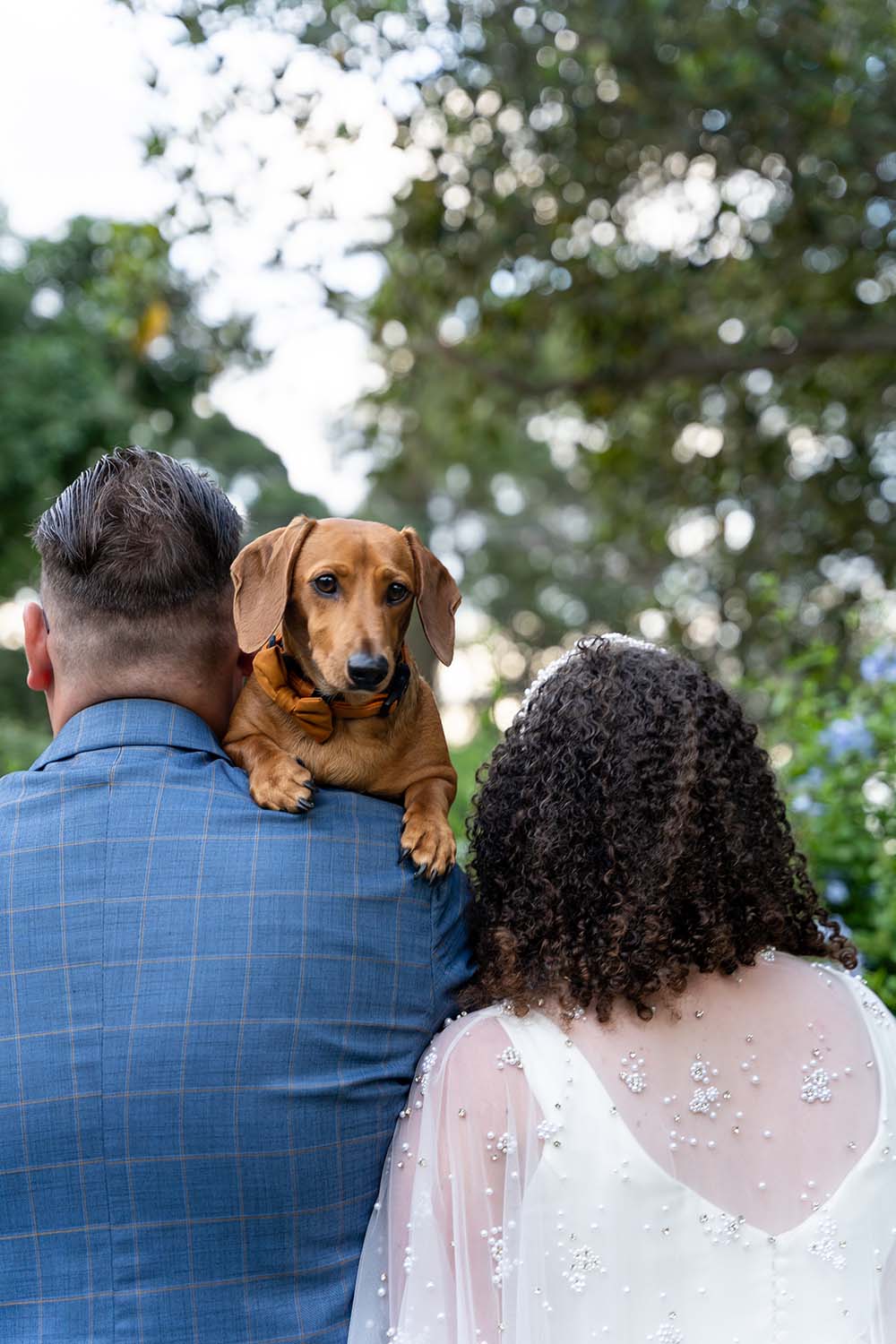Wedding Photography - Carrying the dog over the shoulder