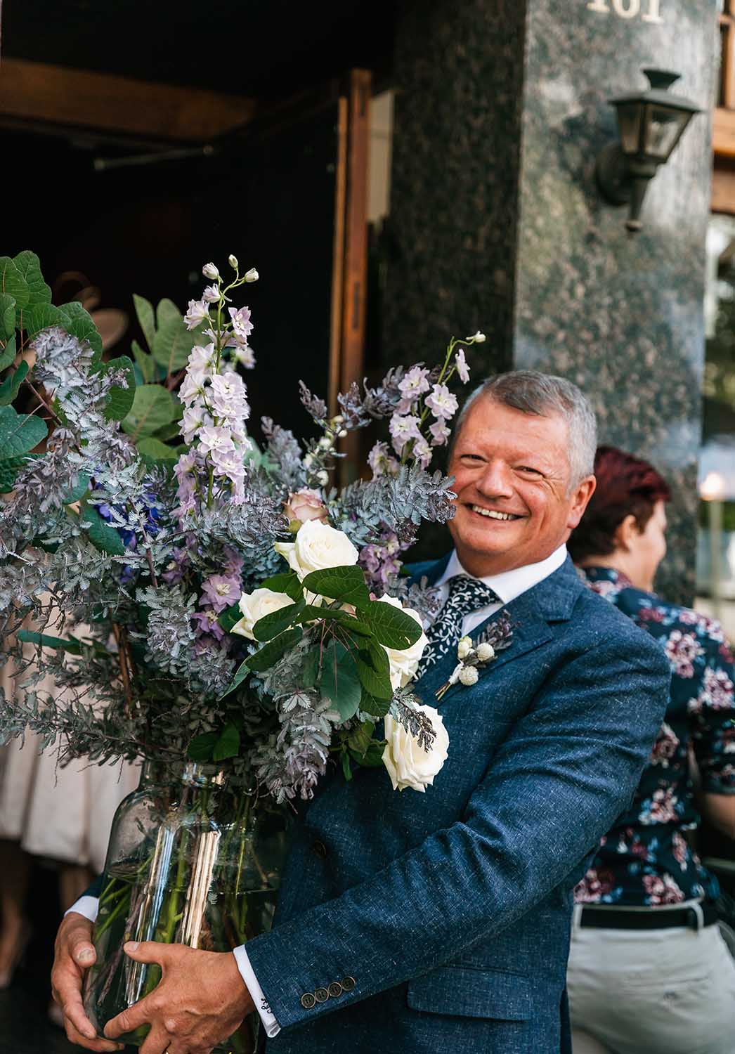 Destination Wedding Photography - Groomsmen Holding Flowers