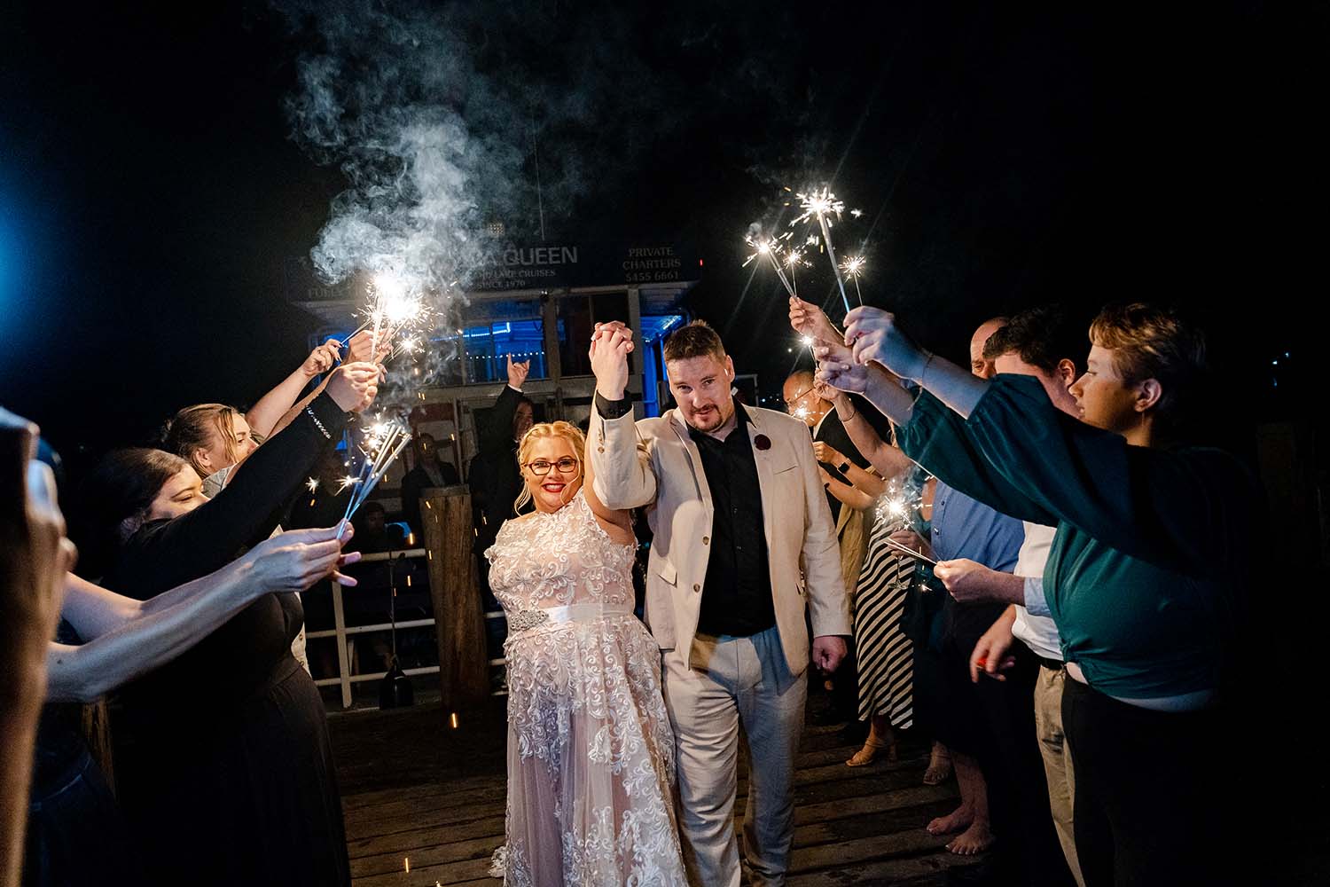 Destination Wedding Photography - bride and groom walking under sparklers