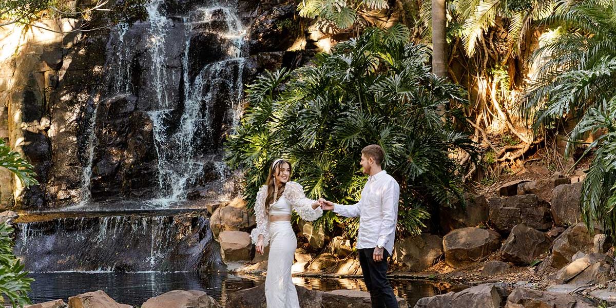 Engagement Photography - couple in front of waterfall