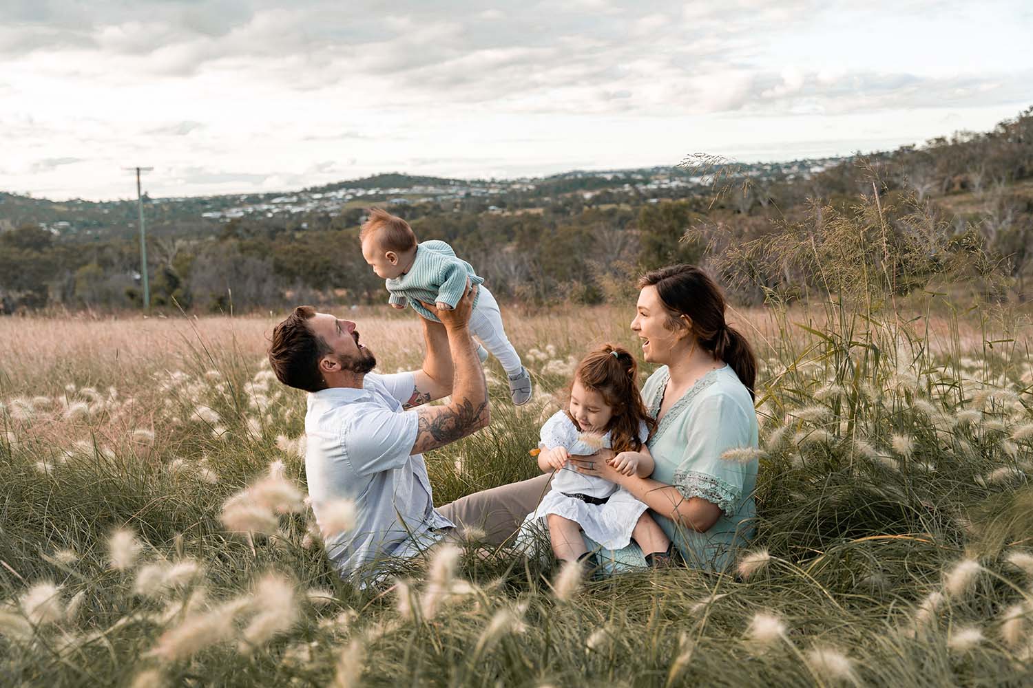Family Photography Toowoomba - family sitting in field