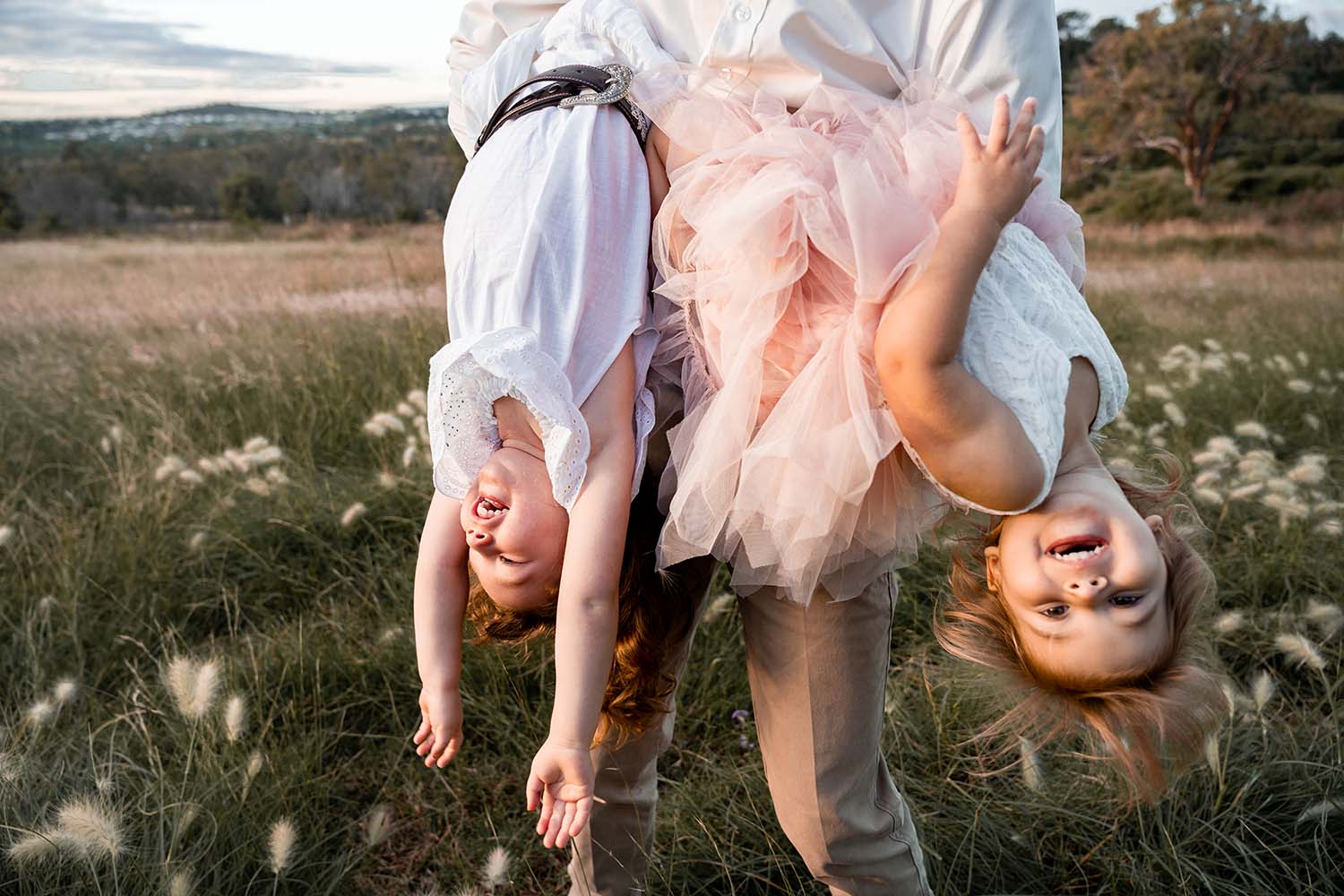 Family Photography Toowoomba – little girls being held upside down