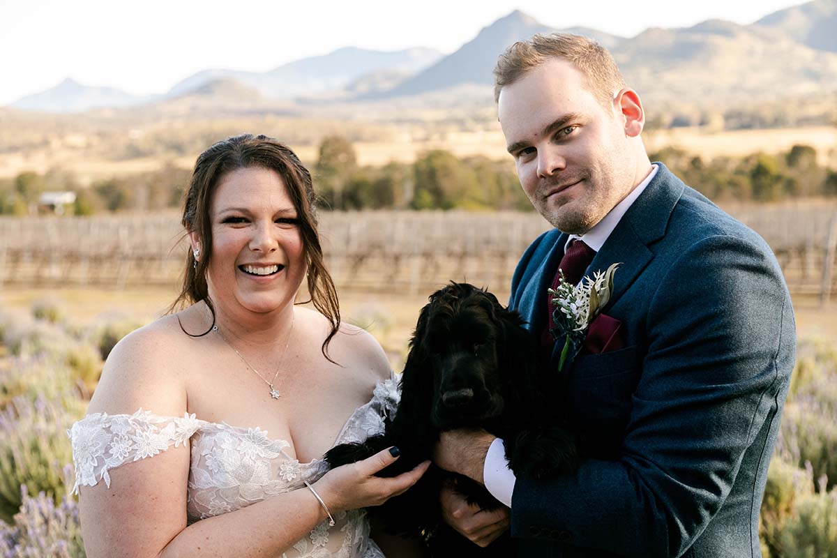 Wedding Photography - bride and groom holding dog