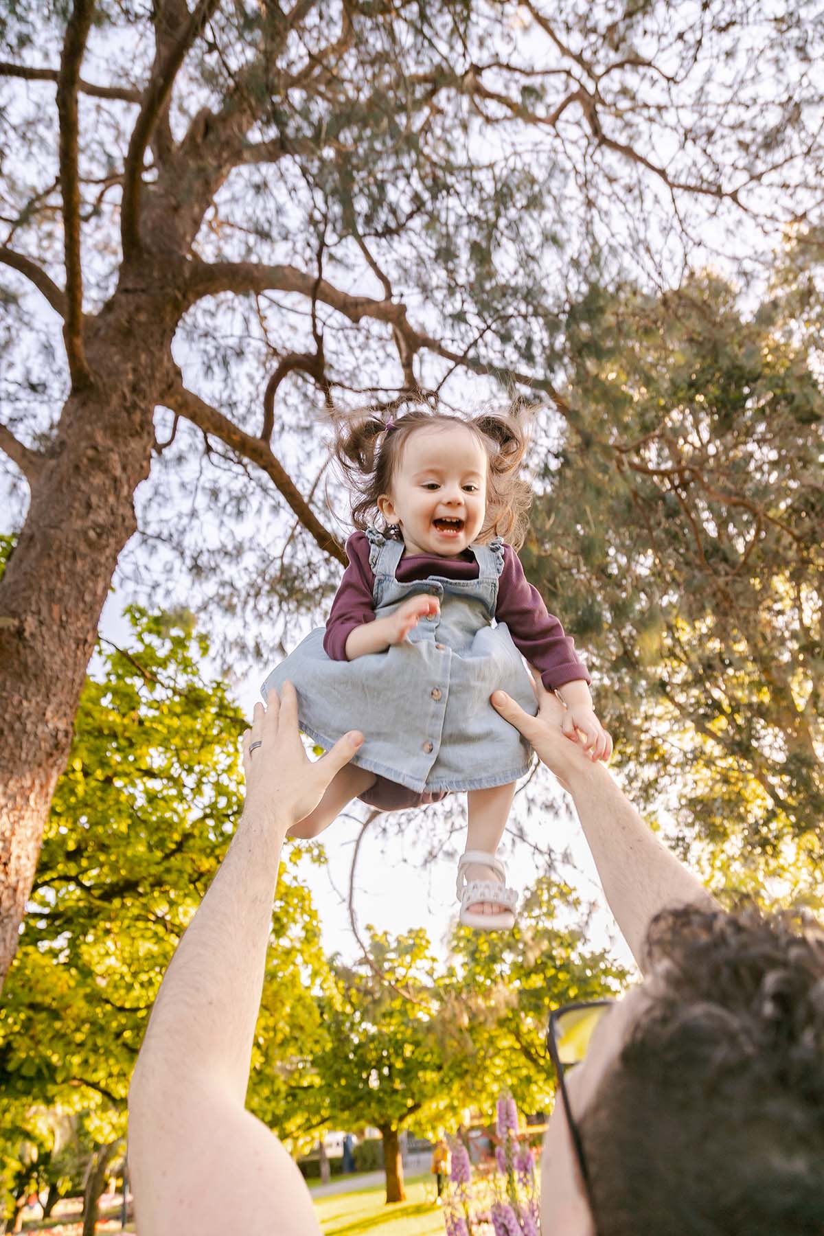 Family Photography - tossing twin into air