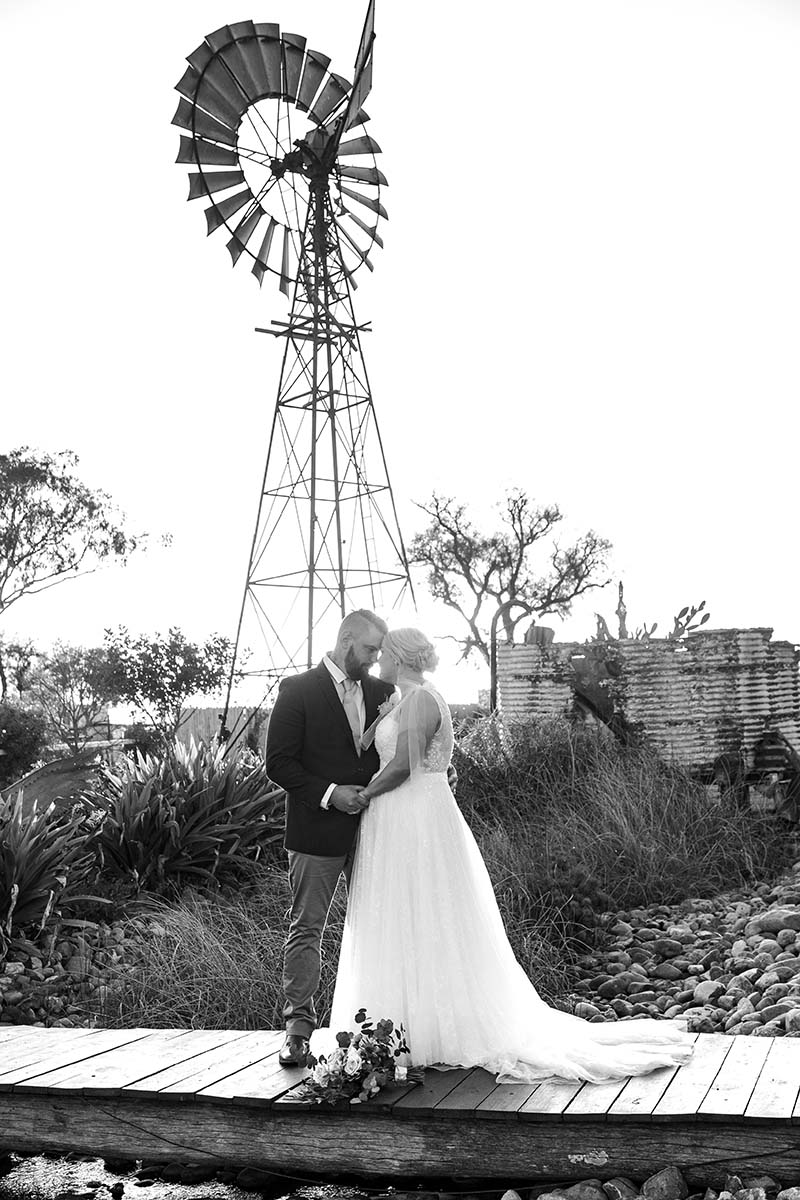 Wedding Photography - bride and groom under windmill