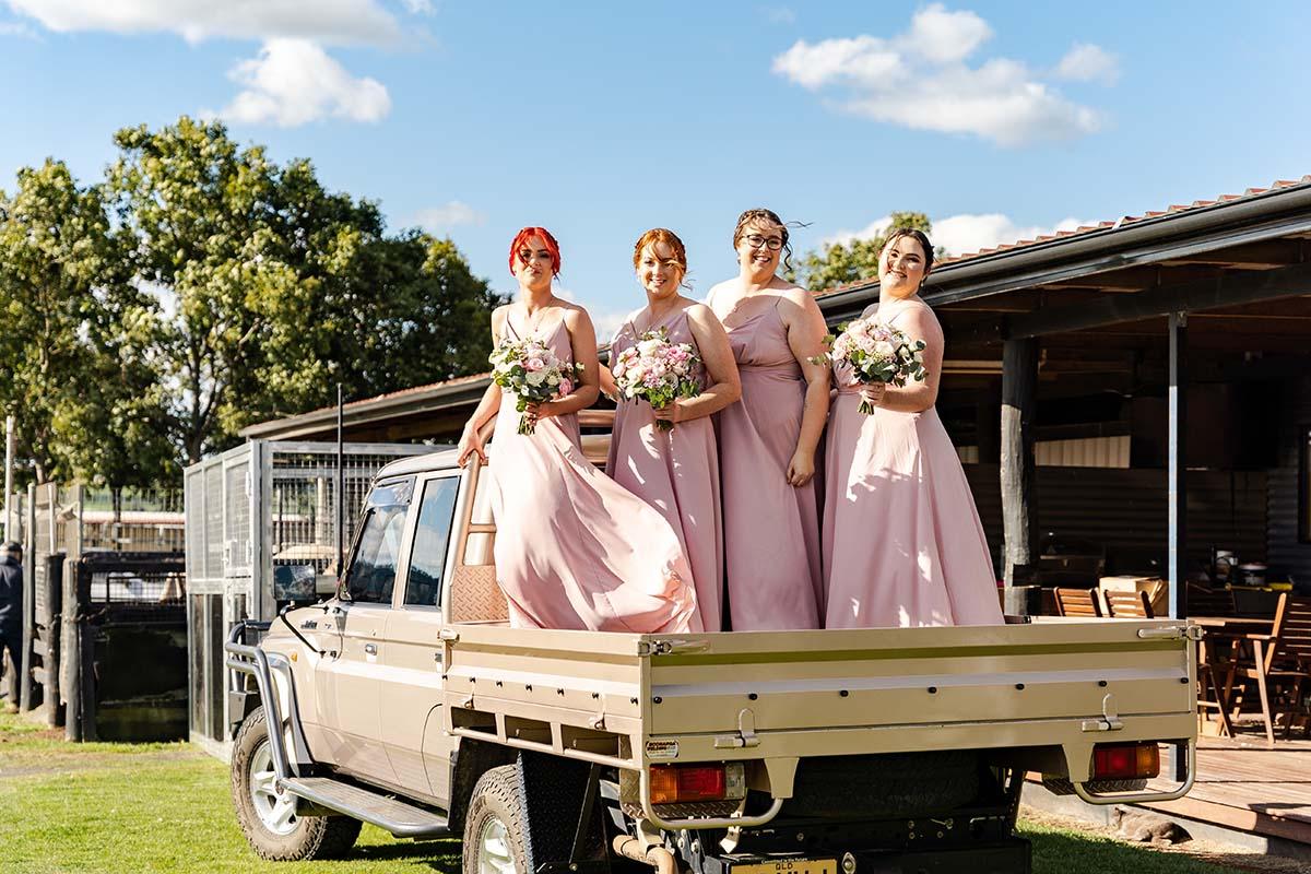 Wedding Photography - bridesmaids on back of ute