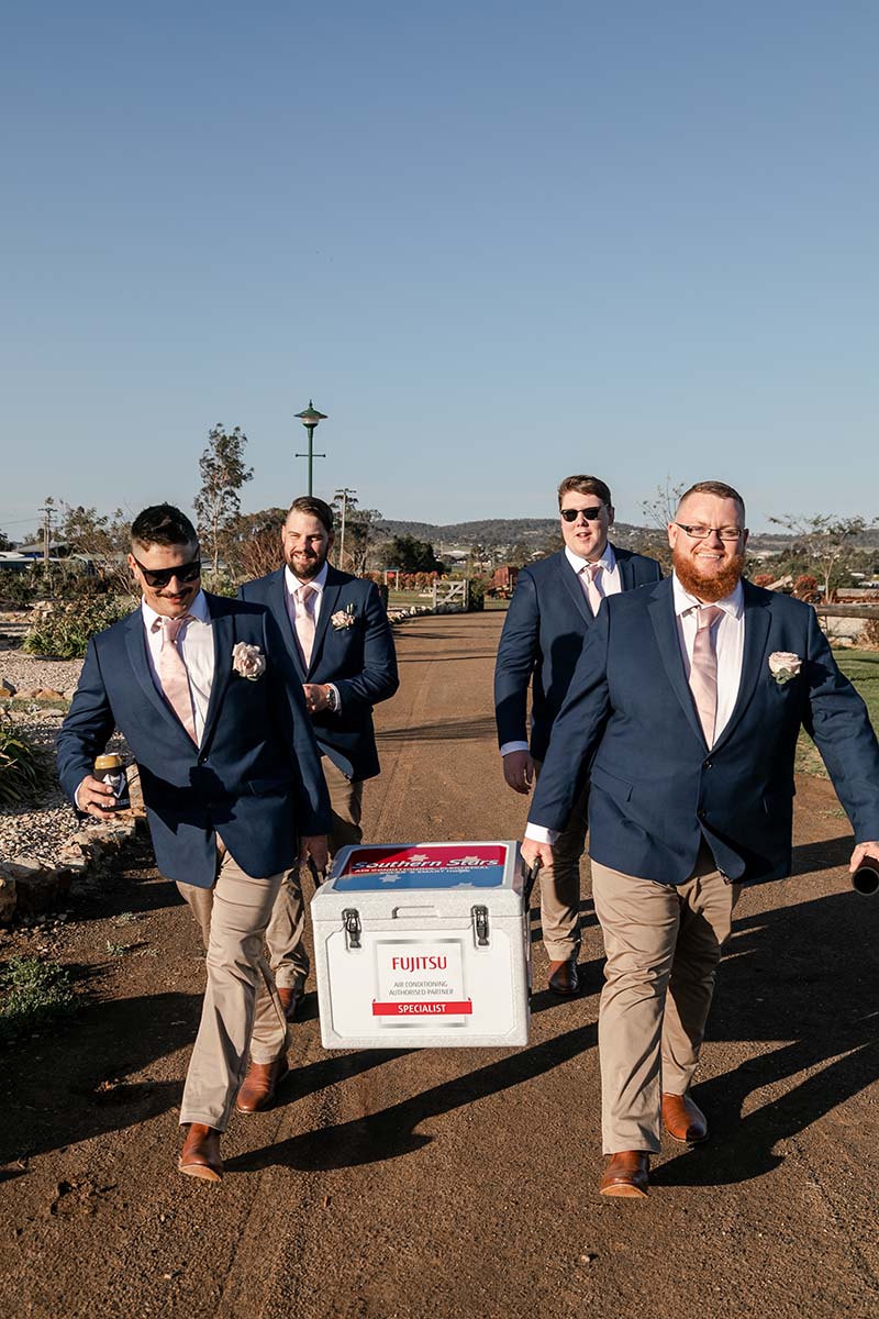 Wedding Photography - groomsmen carrying esky