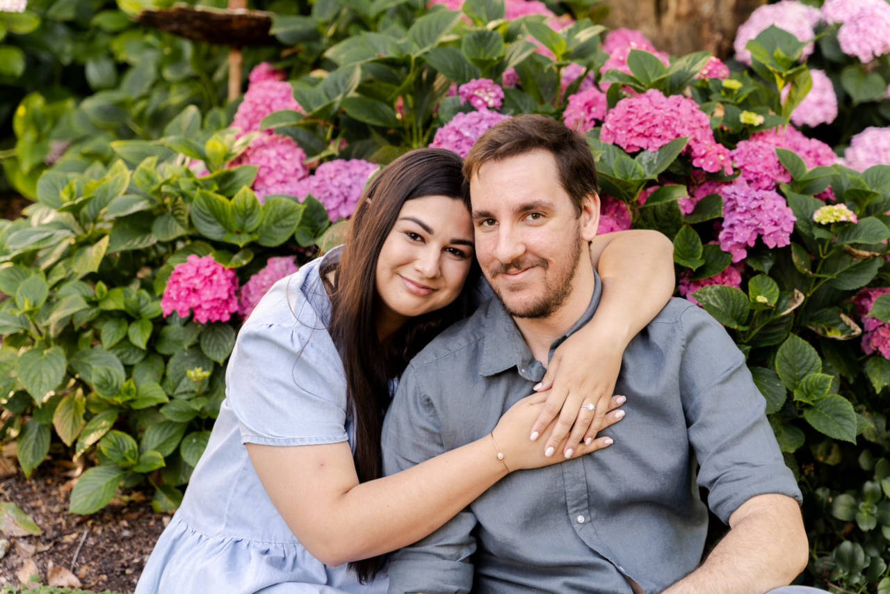 Engagement Photography Couple Embracing with flowers