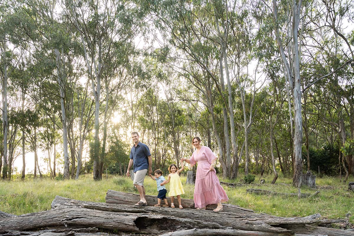Family Photography - family walking across a log