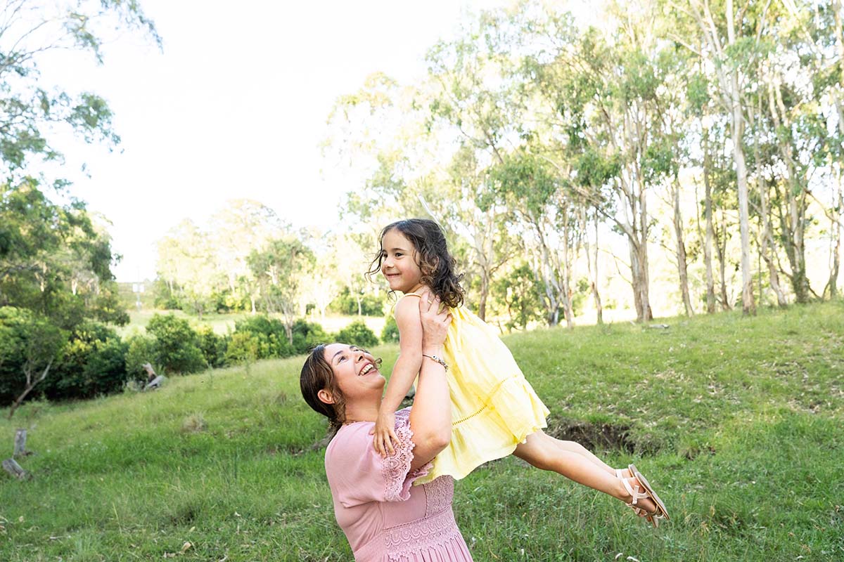 Family Photography - mother lifting daughter