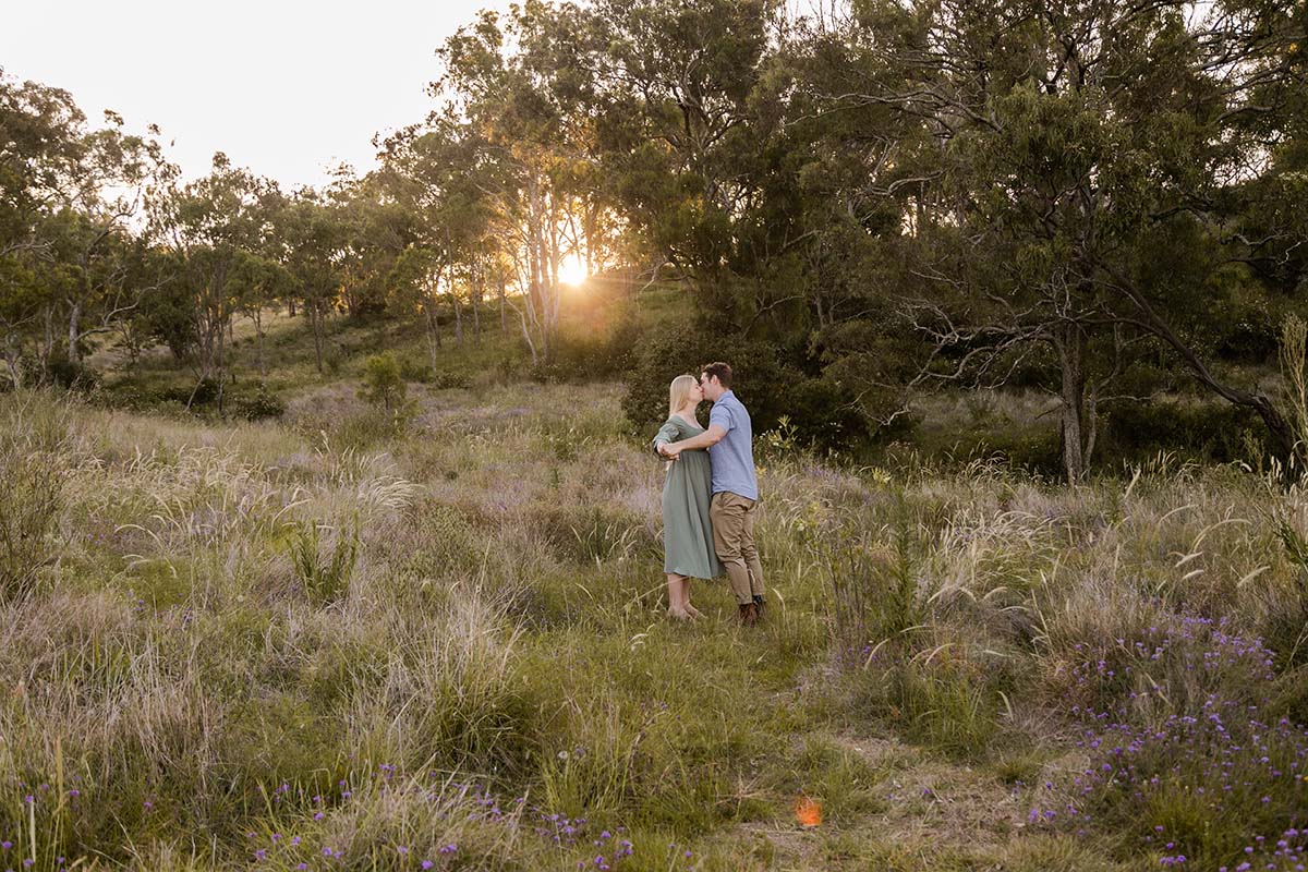 Maternity Photography - couple embracing in field