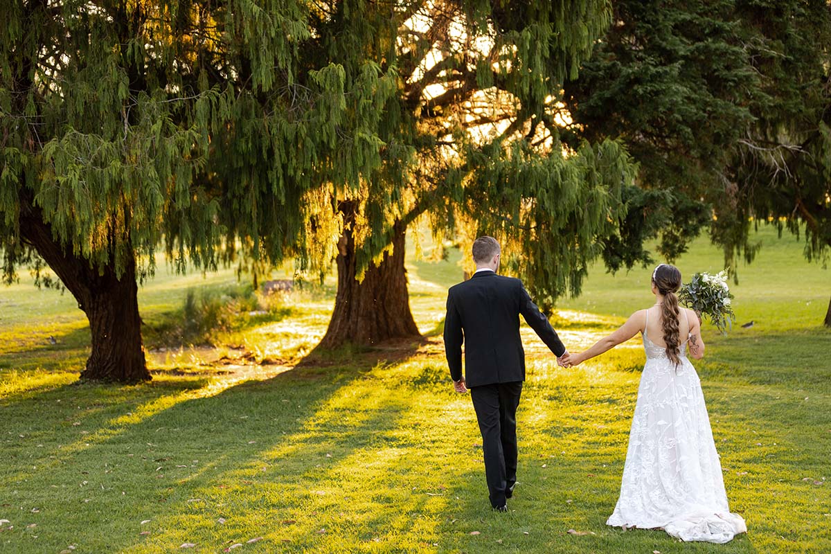 Wedding Photography - bride and groom walking away