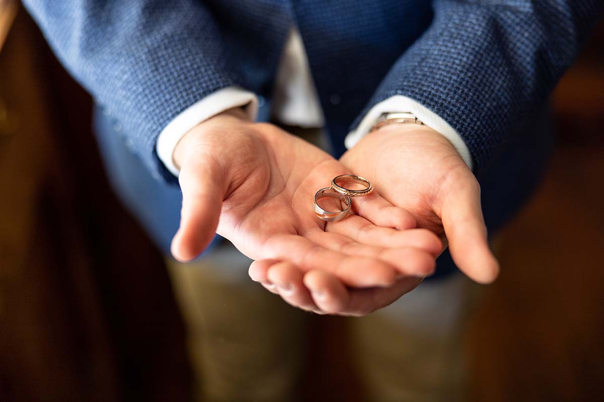 Wedding Photography - groom holding rings