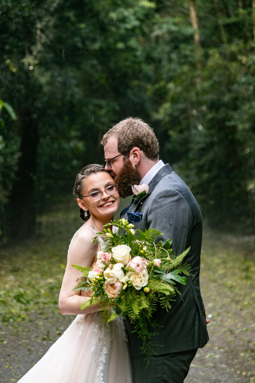 Lewis & Patricia O'Reillys Rainforest retreat Elopement - Groom kissing bride on their head