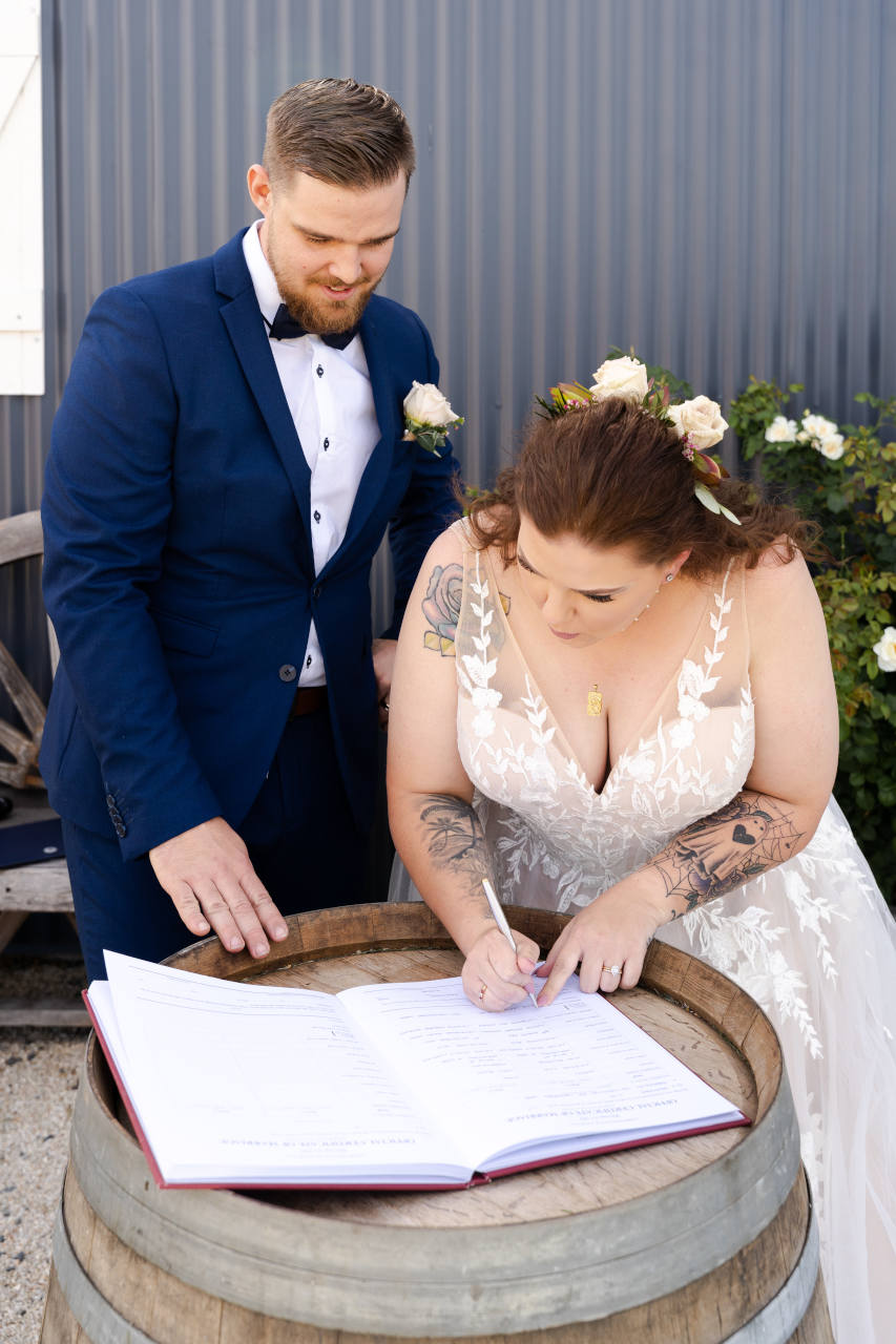 Cory Kaleisha Aberfeldy Barn wedding westbrook Bride and Groom signing