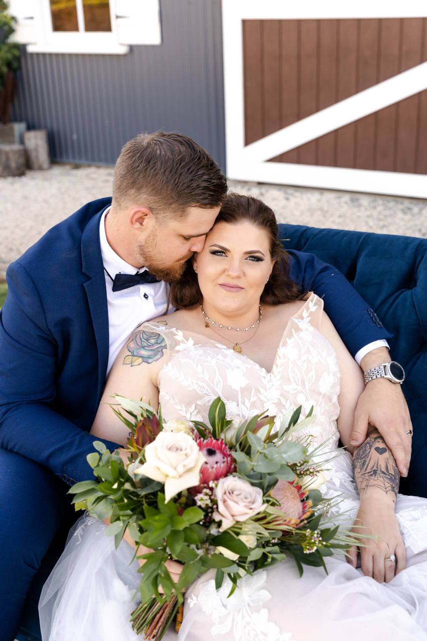 Cory Kaleisha Aberfeldy Barn wedding westbrook Groom embracing Bride