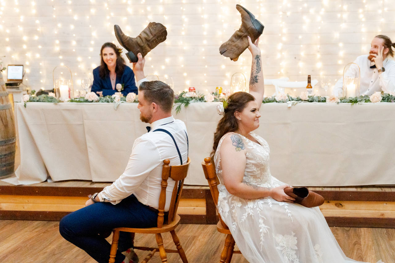 Cory Kaleisha Aberfeldy Barn wedding westbrook bride and groom holding boot above head