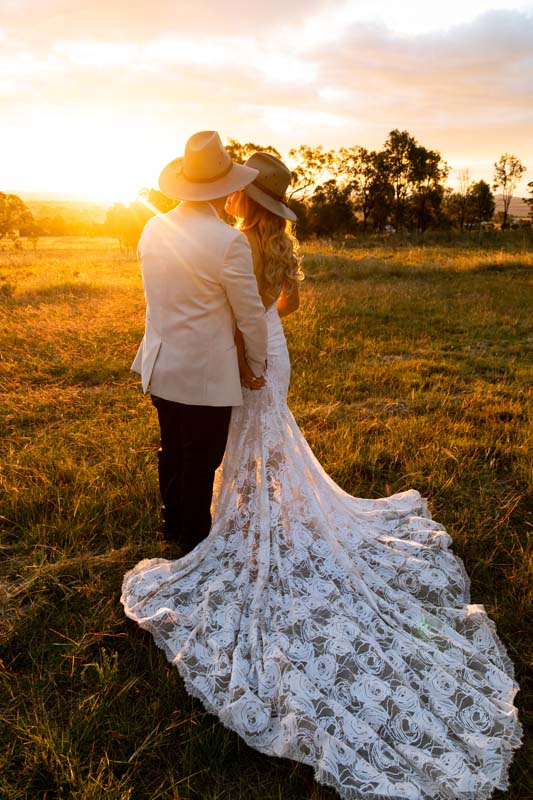 Wedding Photography bride and groom embracing at sunset