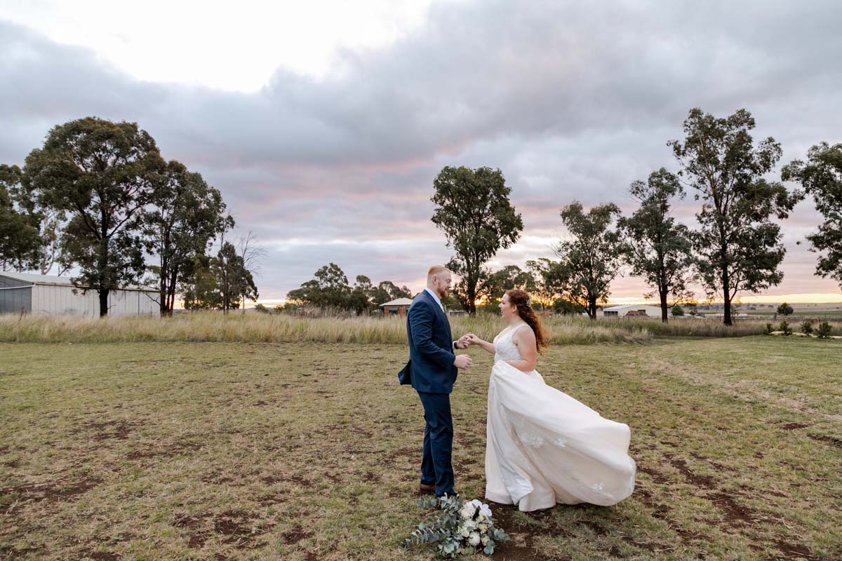 Wedding Photography bride and groom in field