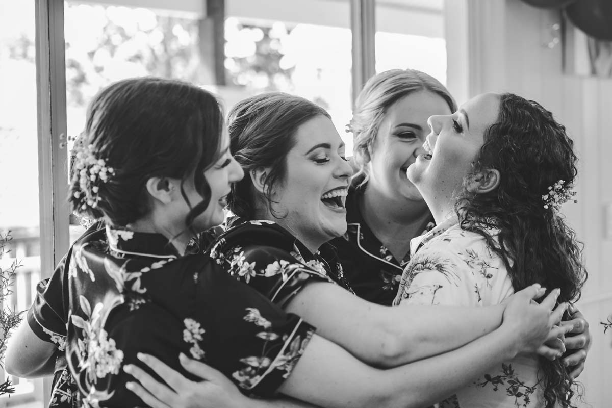 Wedding Photography bridesmaids group hug