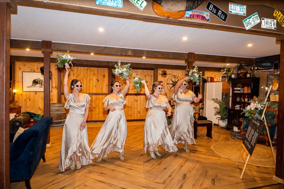 Wedding Photography bridesmaids throwing boquets in the air