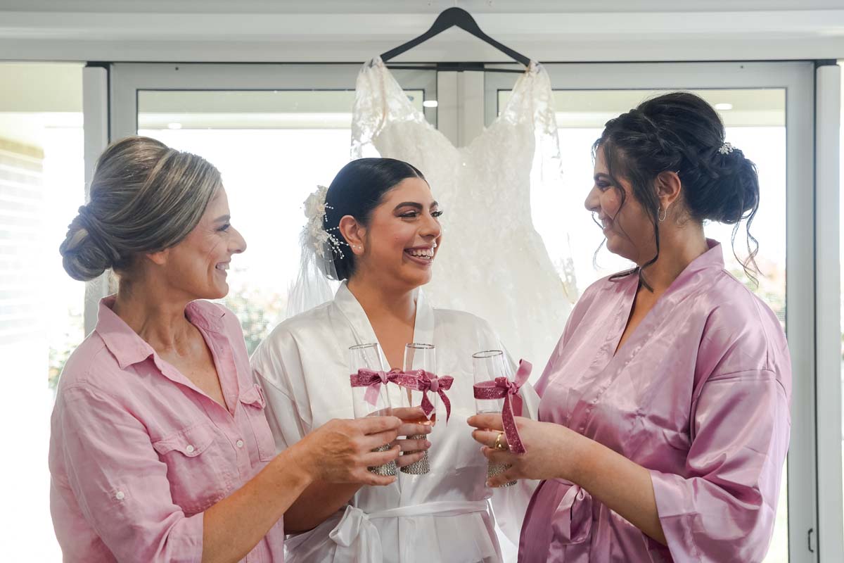 Wedding Photography bridal party cheering drinks