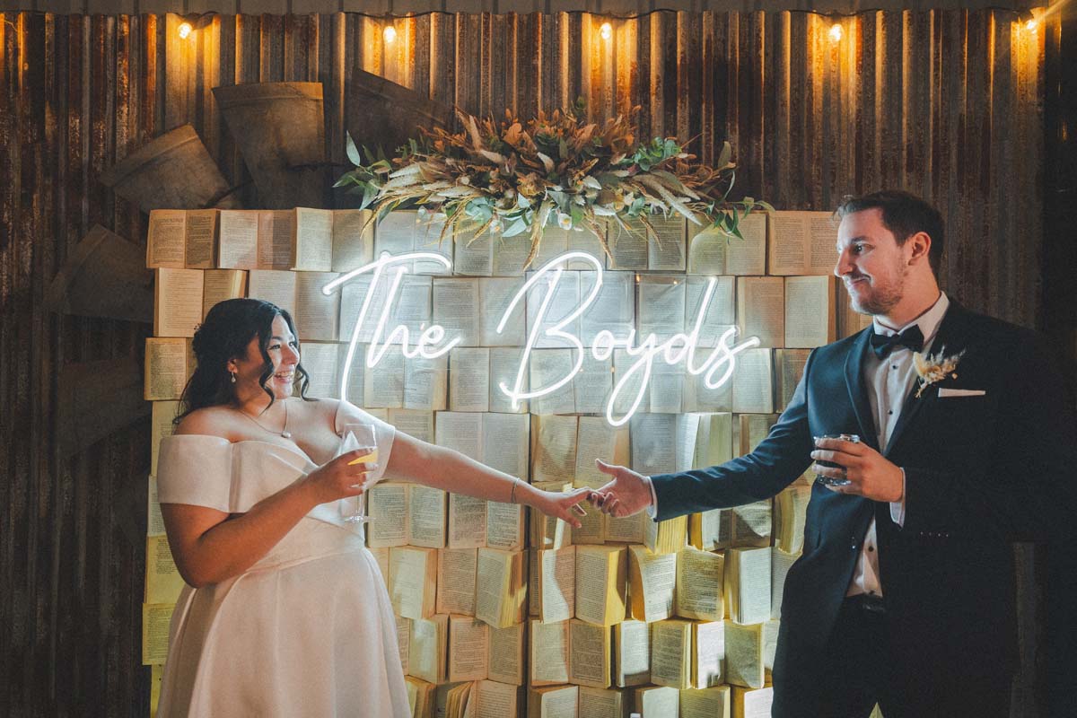 Wedding Photography bride and groom under sign