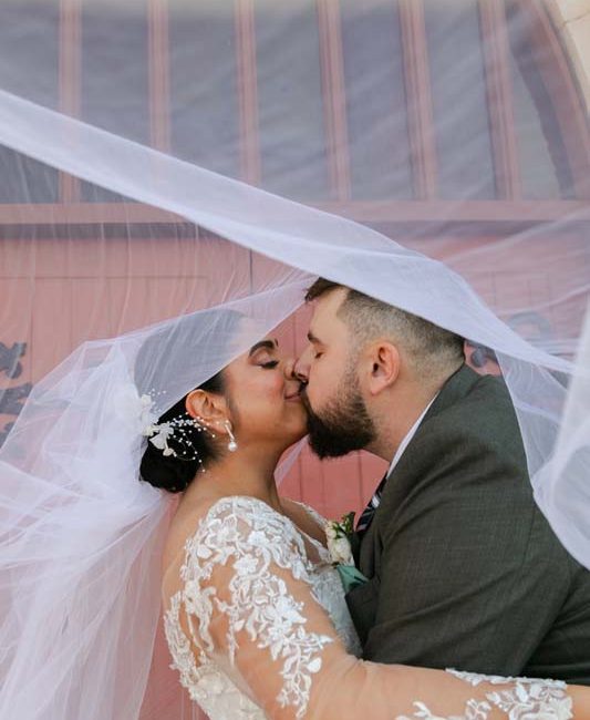 Wedding Photography bride and groom under veil