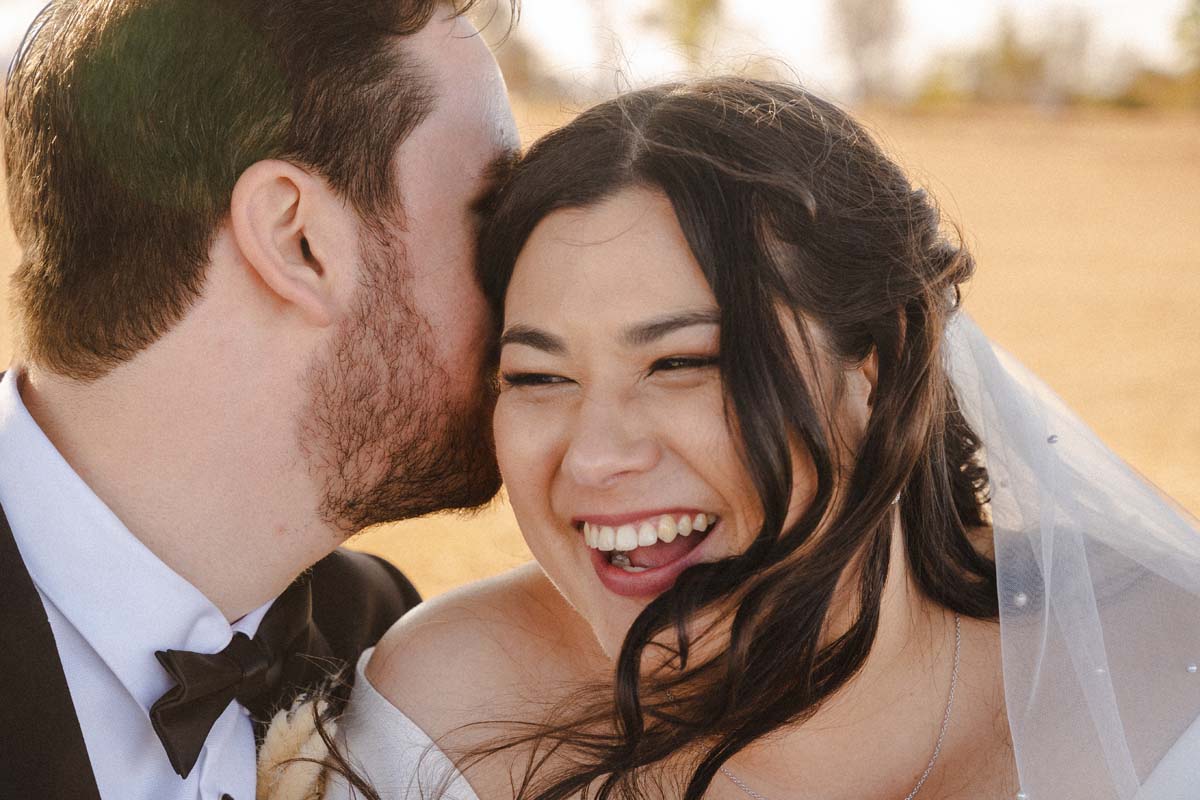 Wedding Photography laughin bride and groom